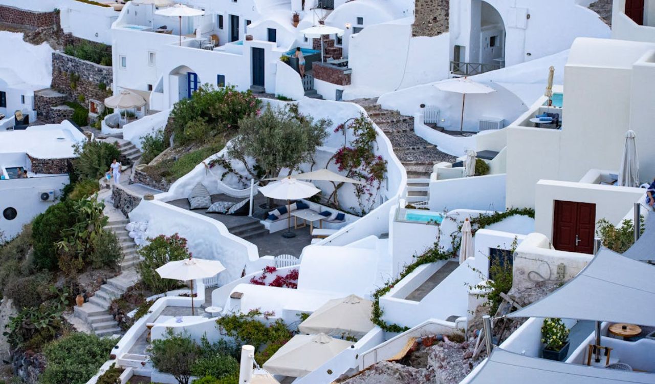 Whitewashed hillside homes with terraces and curved steps