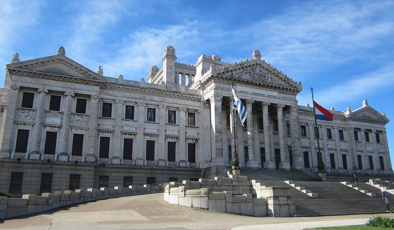 The grand neoclassical Palacio Legislativo in Montevideo, Uruguay, stands tall under a clear blue sky