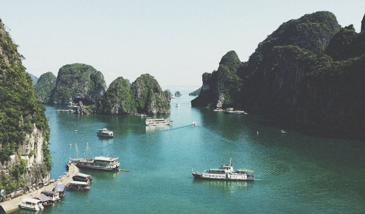 Boats cruise through Vietnam’s emerald waters