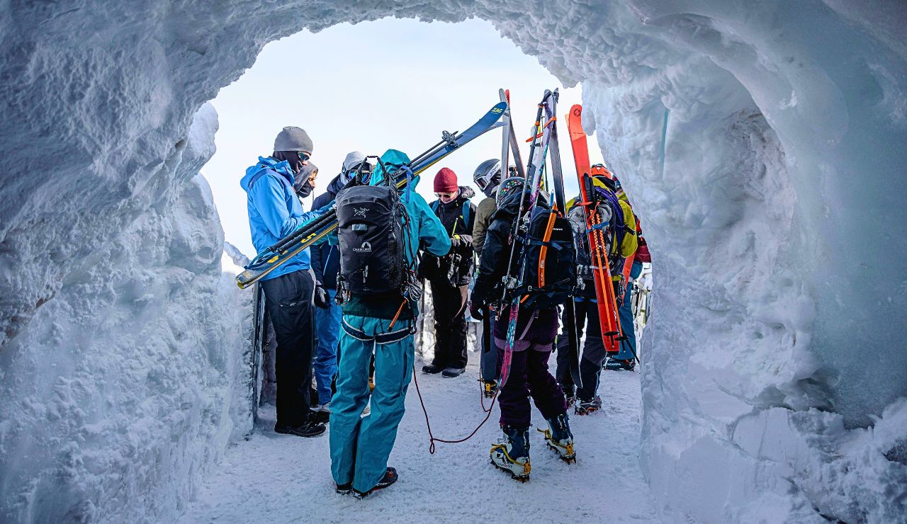 Guide leading a group across Mendenhall Glacier toward the caves