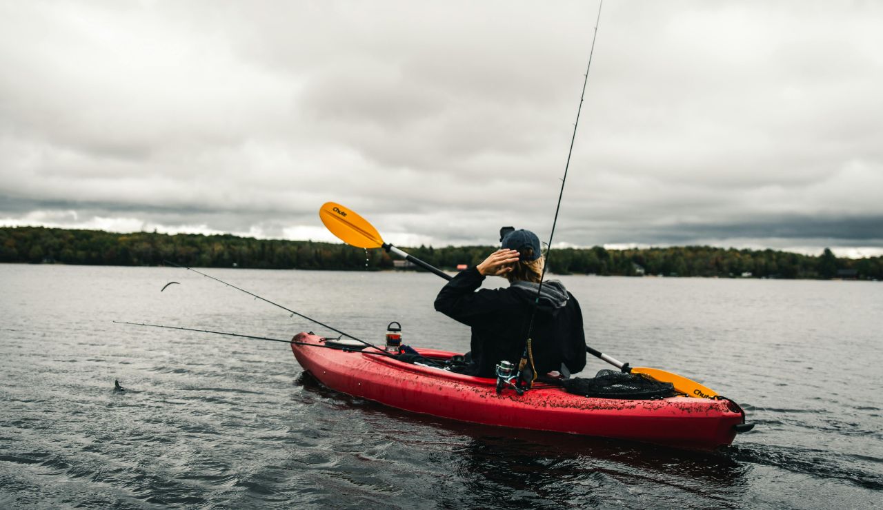 Canoe floating on a calm lake at sunset in Algonquin Provincial Park.