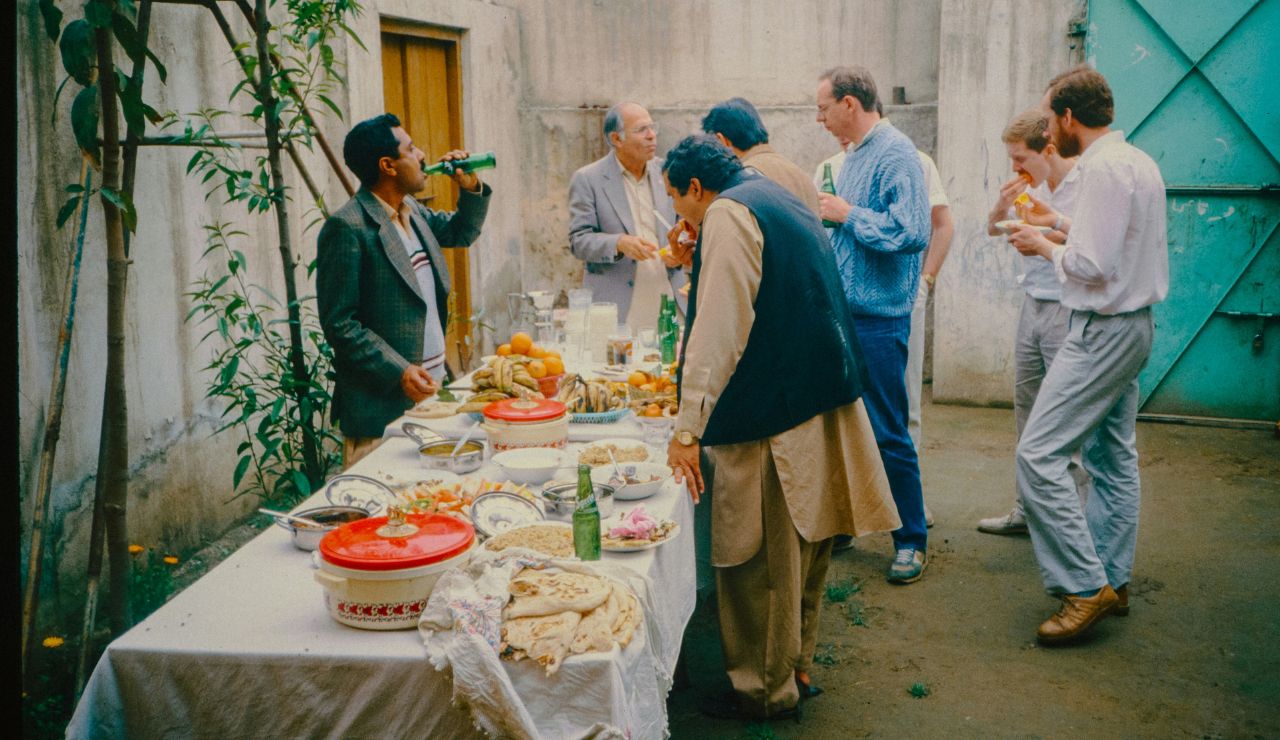 Locals sharing a meal with a visitor in a Bangladeshi home