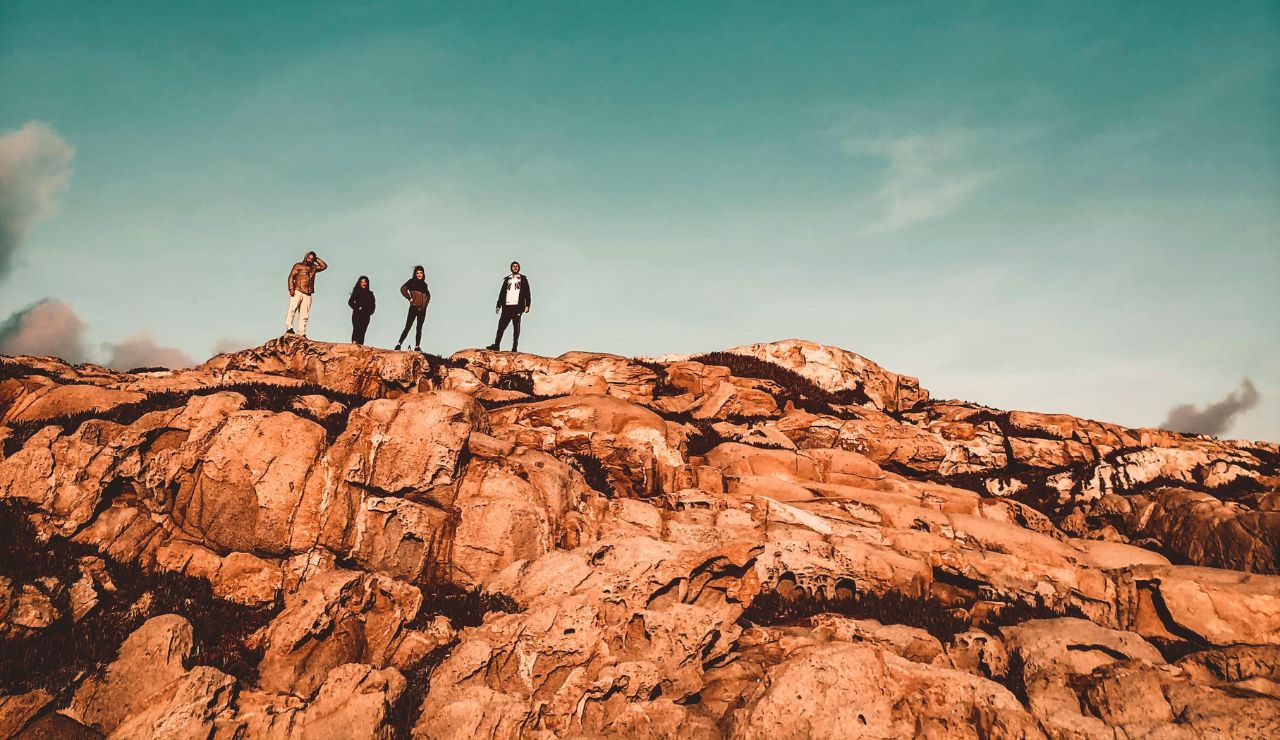 Visitors walk among towering rock pillars at the Bay of Fundy.