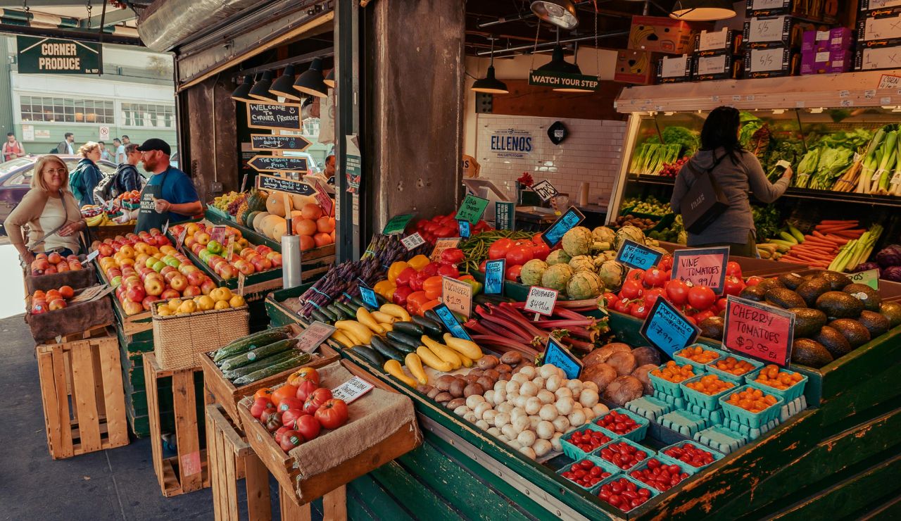 Covered porticoes and fresh food stands in Bologna’s historic center