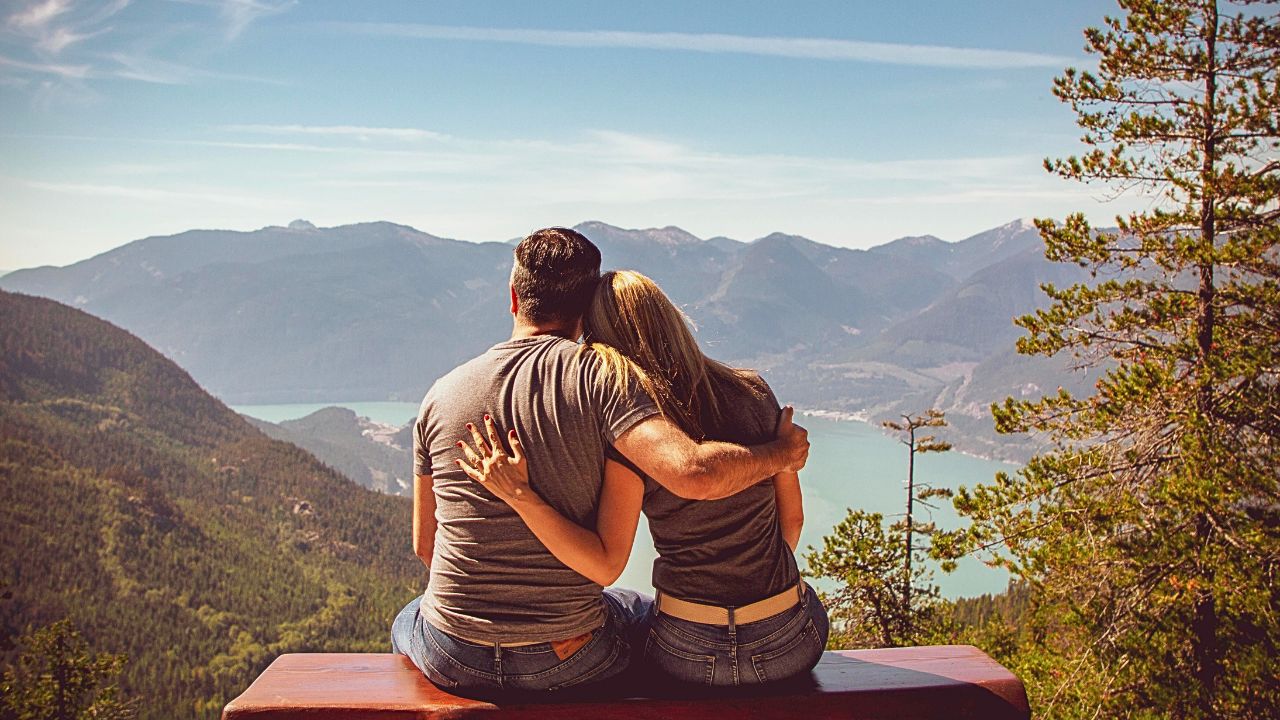 Couple sitting quietly overlooking a serene natural view