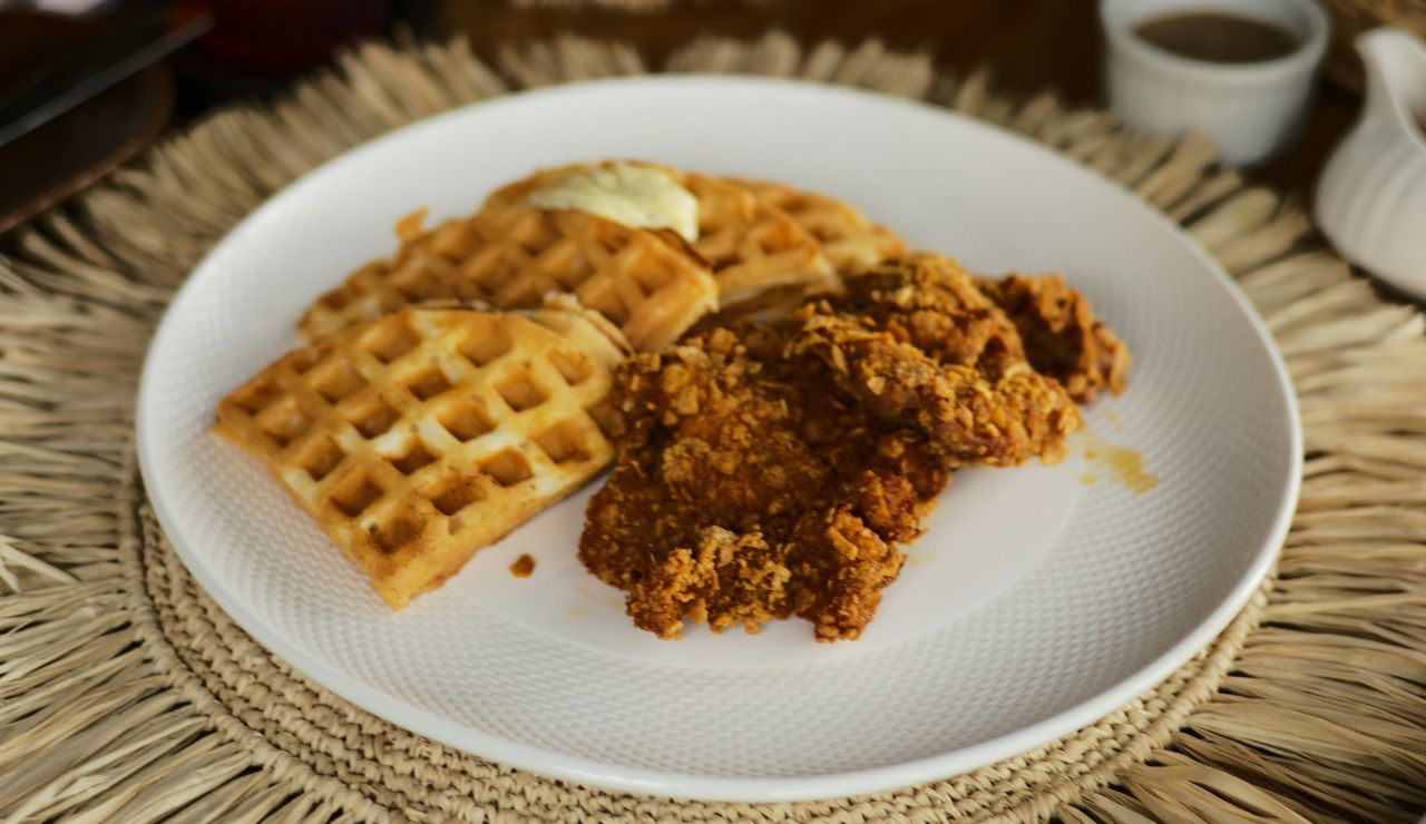 Plate of fried chicken and waffles with syrup