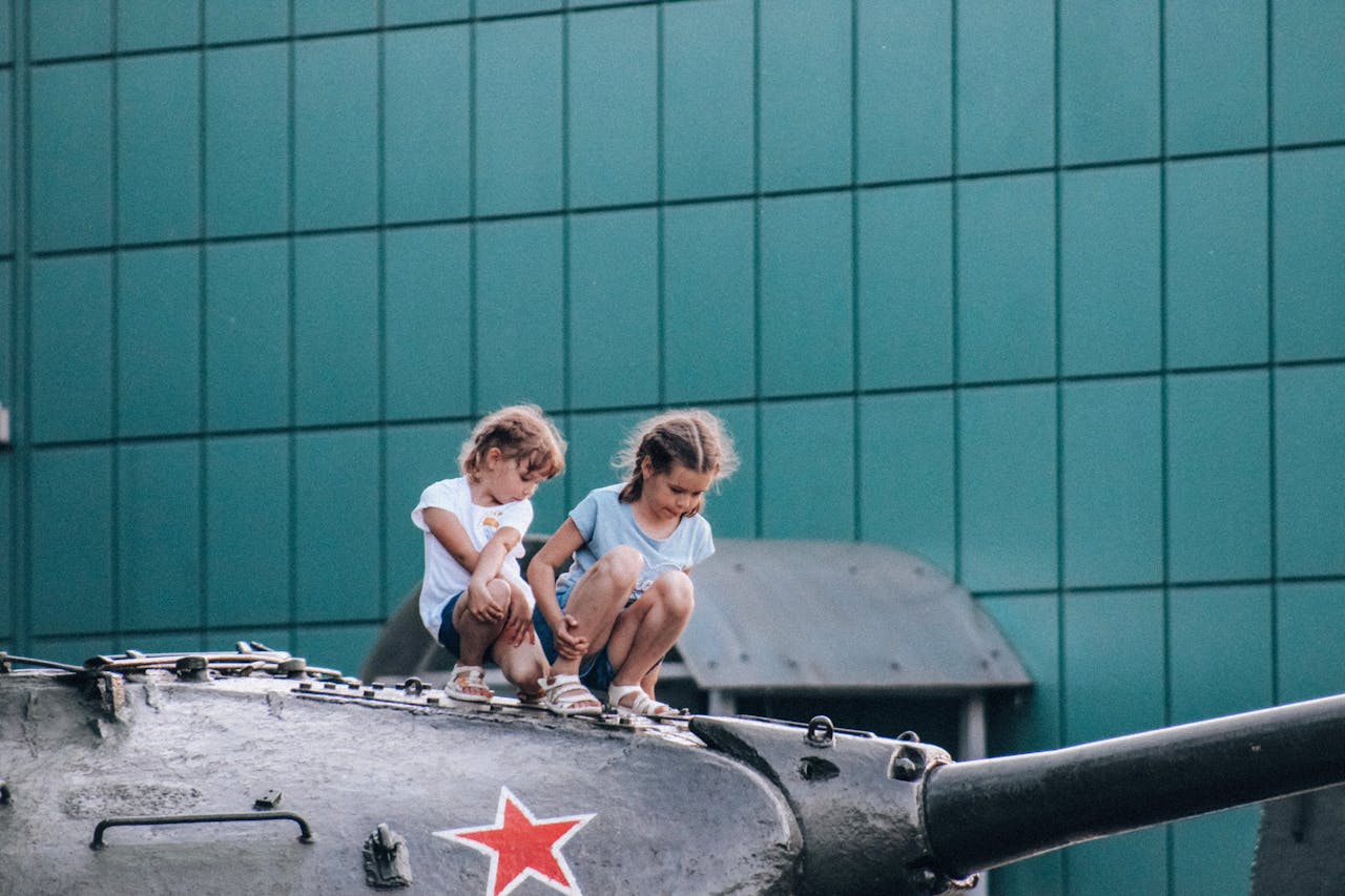 Children atop a war machine