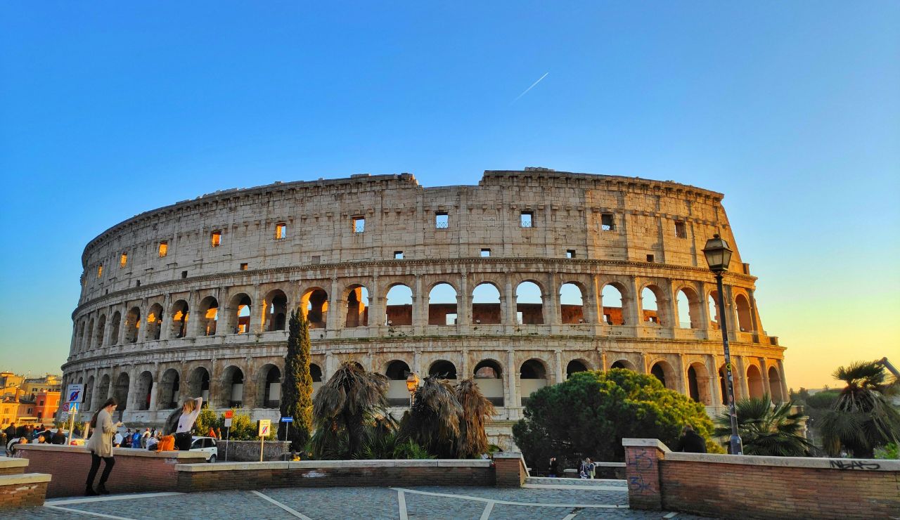 The Colosseum in Rome glowing in afternoon sunlight.