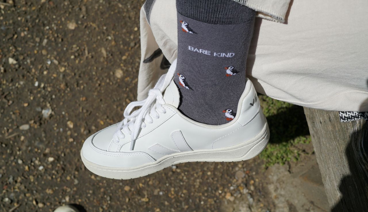 Traveler wearing compression socks to improve circulation on a long flight