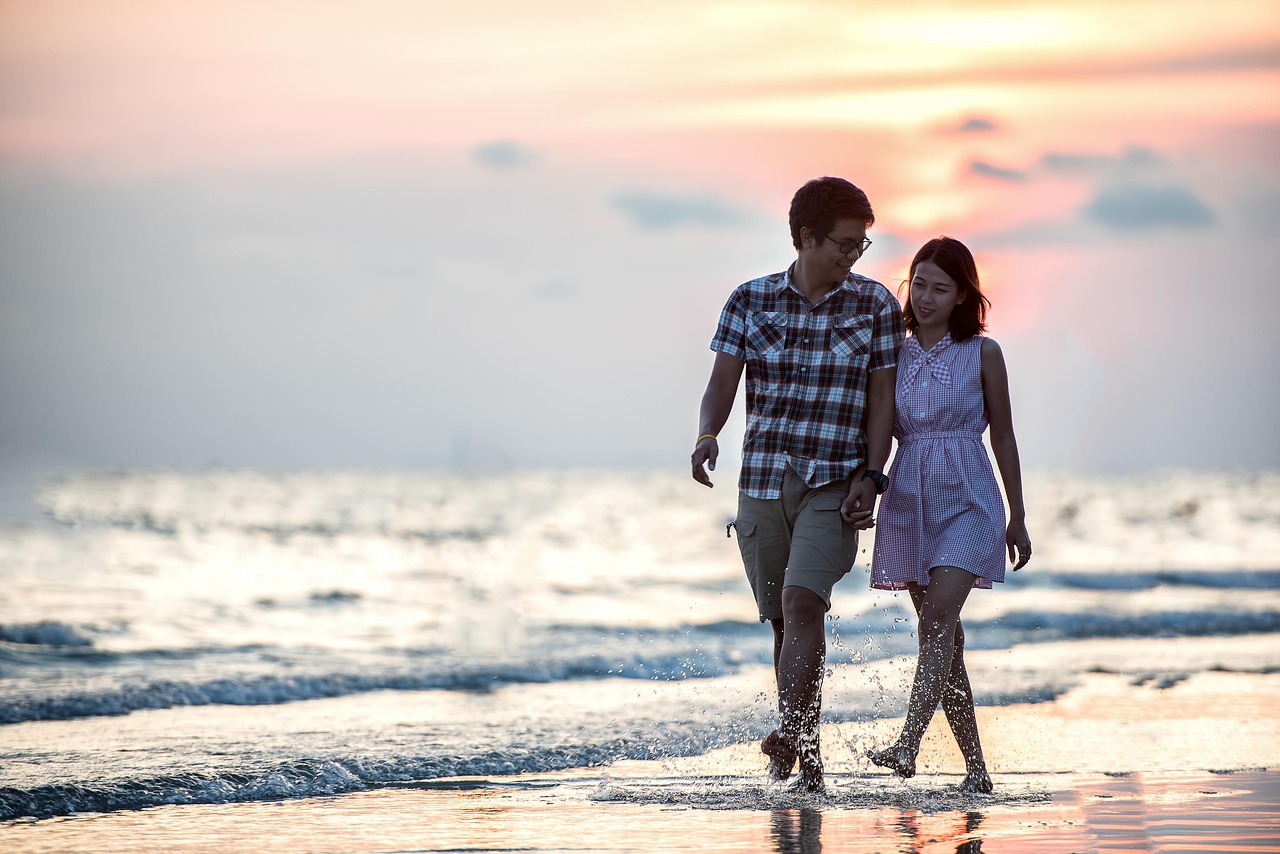 Couple walking along a beach