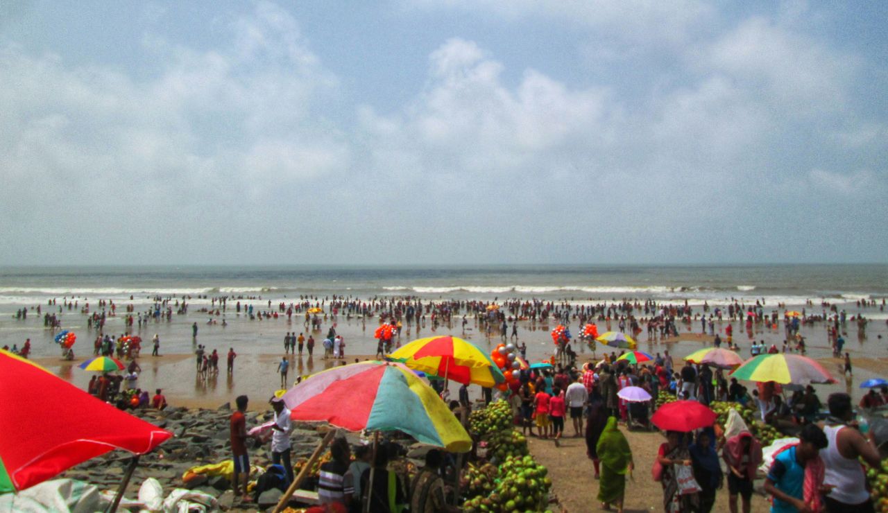 Wide sandy beach with gentle waves at Cox’s Bazar