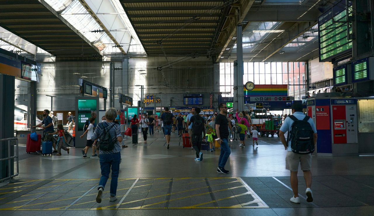 Busy Italian train station with travelers and luggage