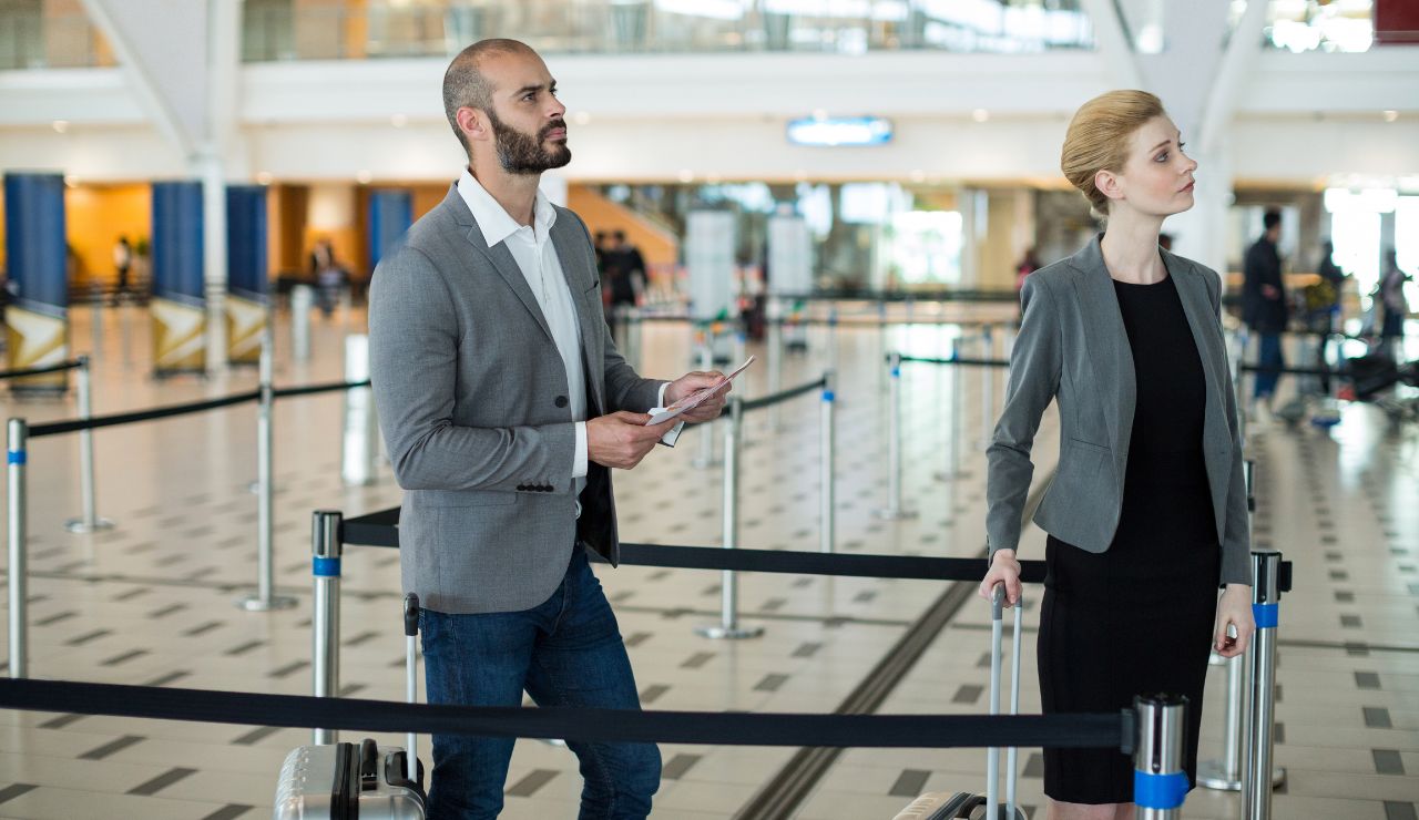Passengers checking in at a modern cruise terminal near departure time.