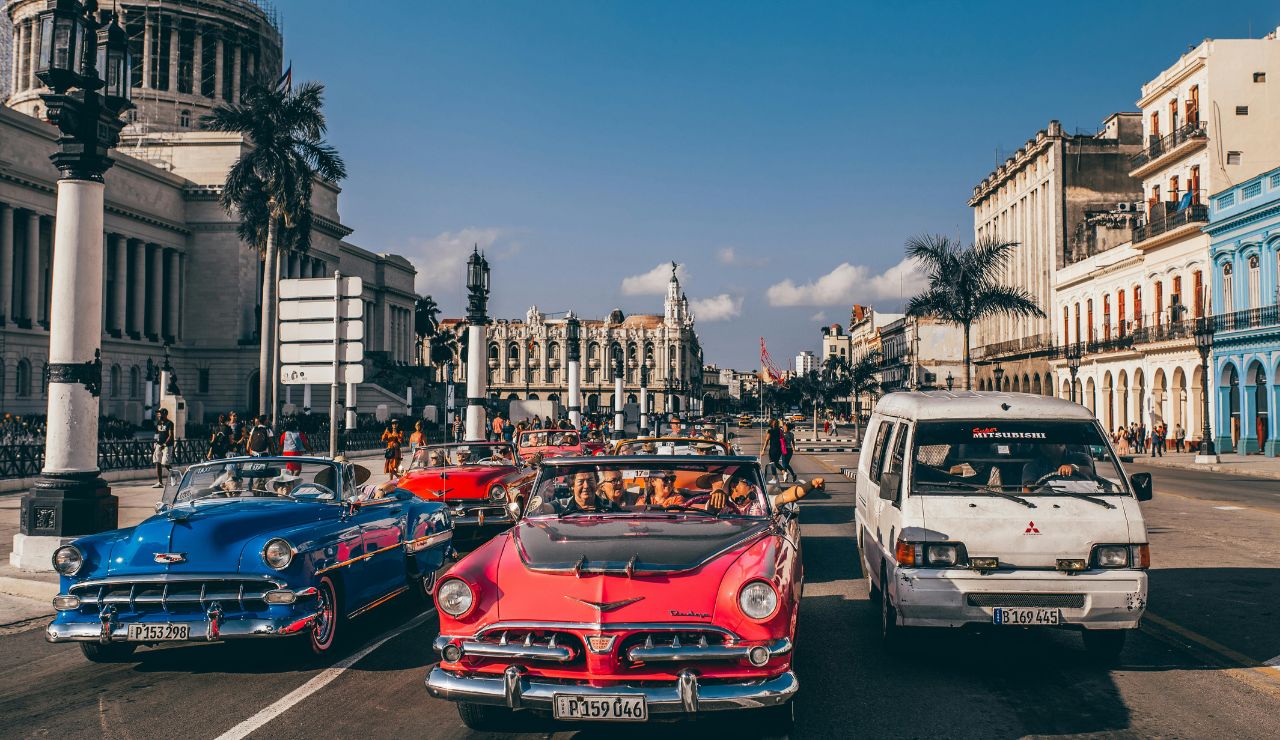Colorful colonial buildings and classic cars in Cuba