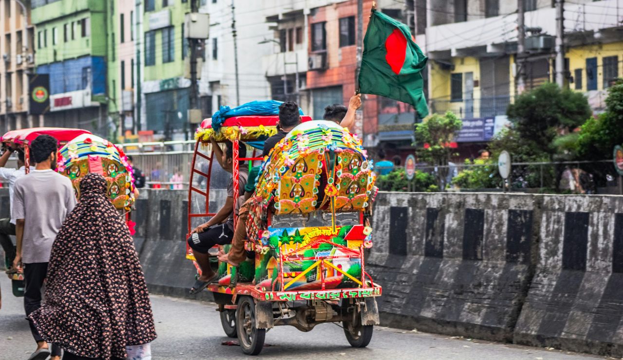 Colorful rickshaws and street activity in Old Dhaka