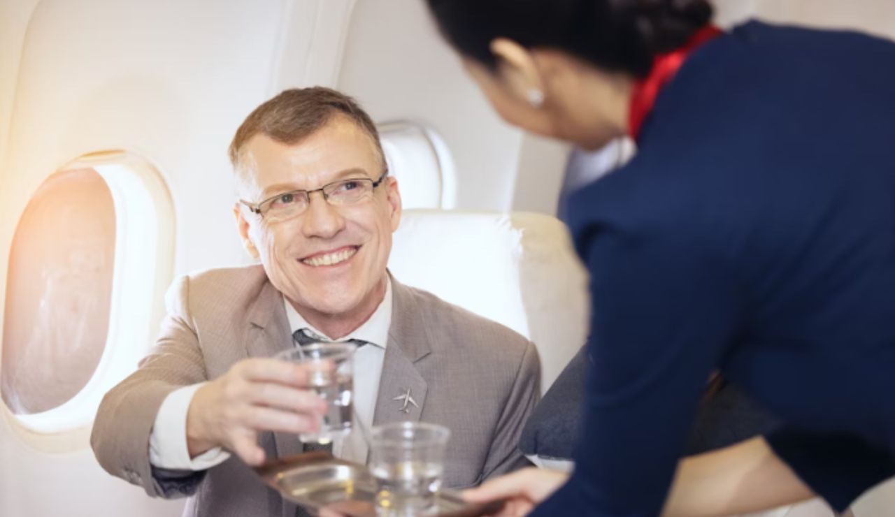 Passenger drinking water on a long-haul flight