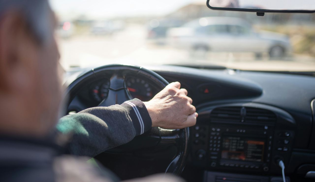 hands on steering wheel during long highway drive