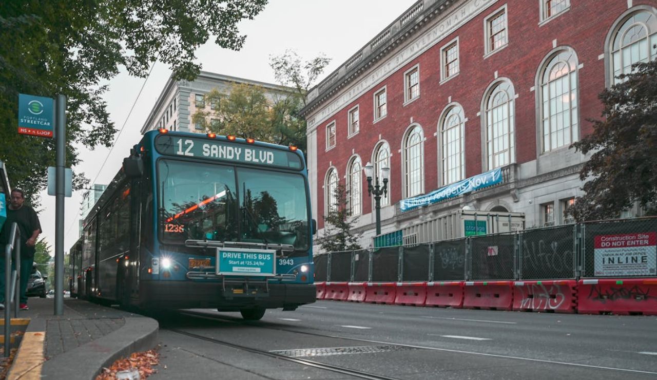 City bus on route 12 Sandy Blvd in Portland, Oregon, emphasizing the importance of public transportation in urban infrastructure.