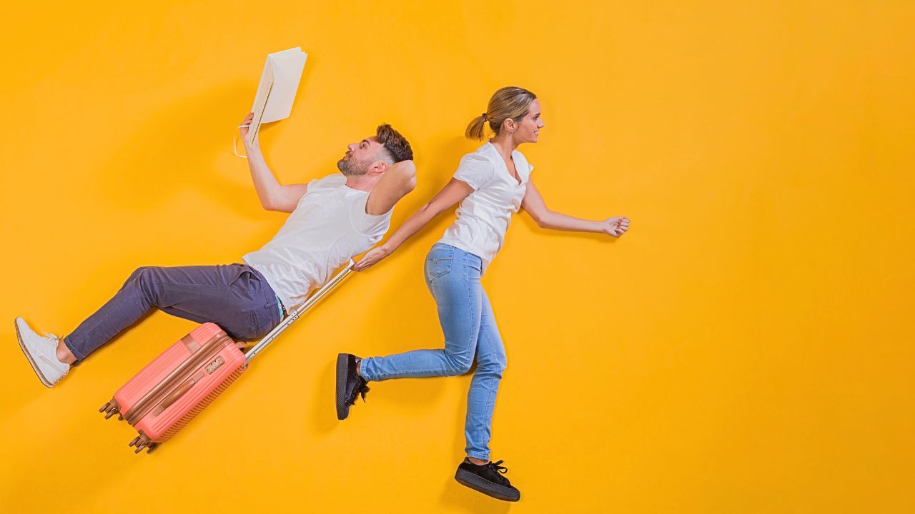 Tired couple with luggage in an airport lounge