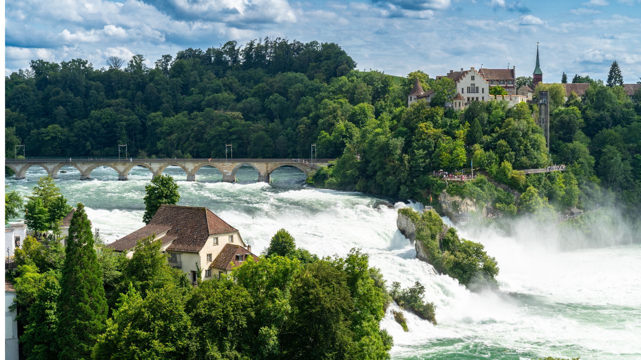 Rhine Falls (Rheinfall) in Switzerland, with castle Schloss Laufen, Neuhausen near the Canton Schaffhausen in Europe