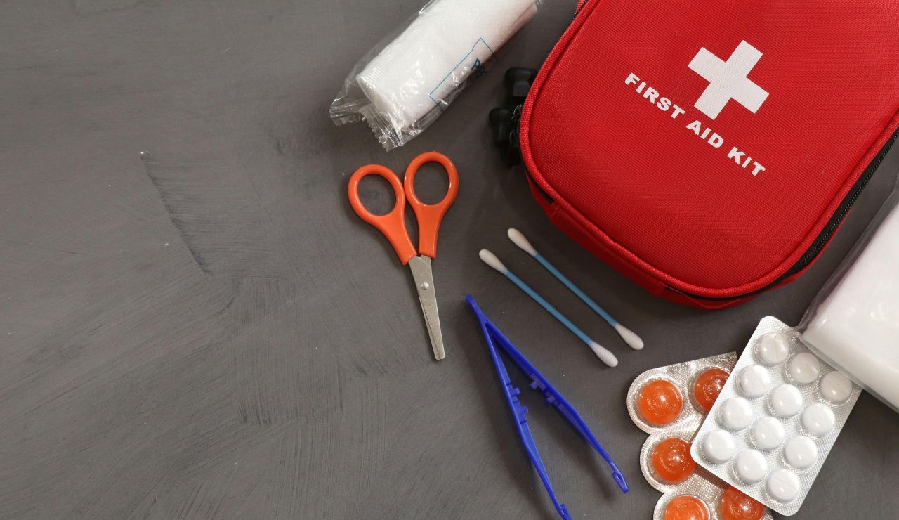 Compact travel first-aid kit with medical supplies.