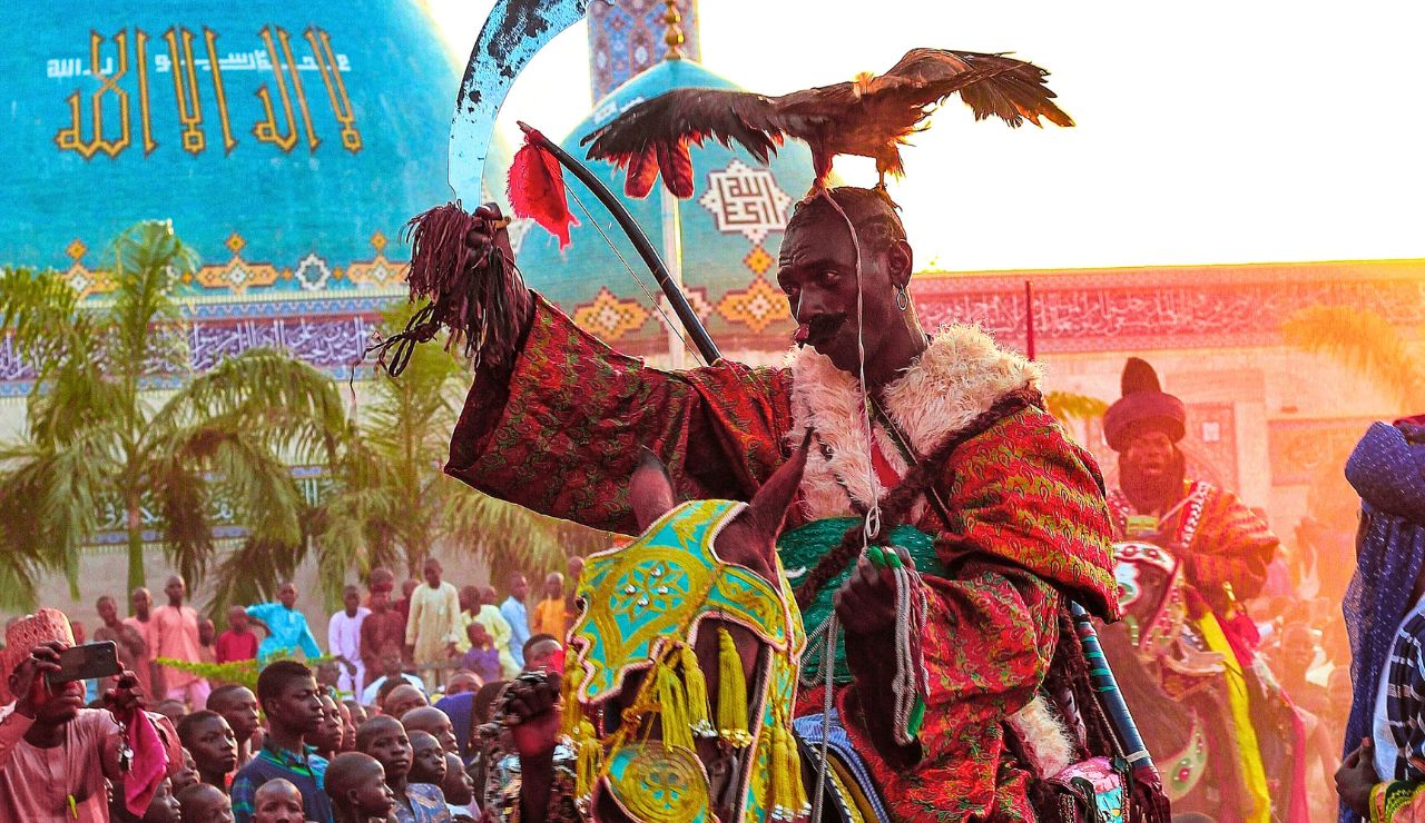 Wodaabe men in elaborate face paint and attire performing courtship dances during the Gerewol Festival in Chad