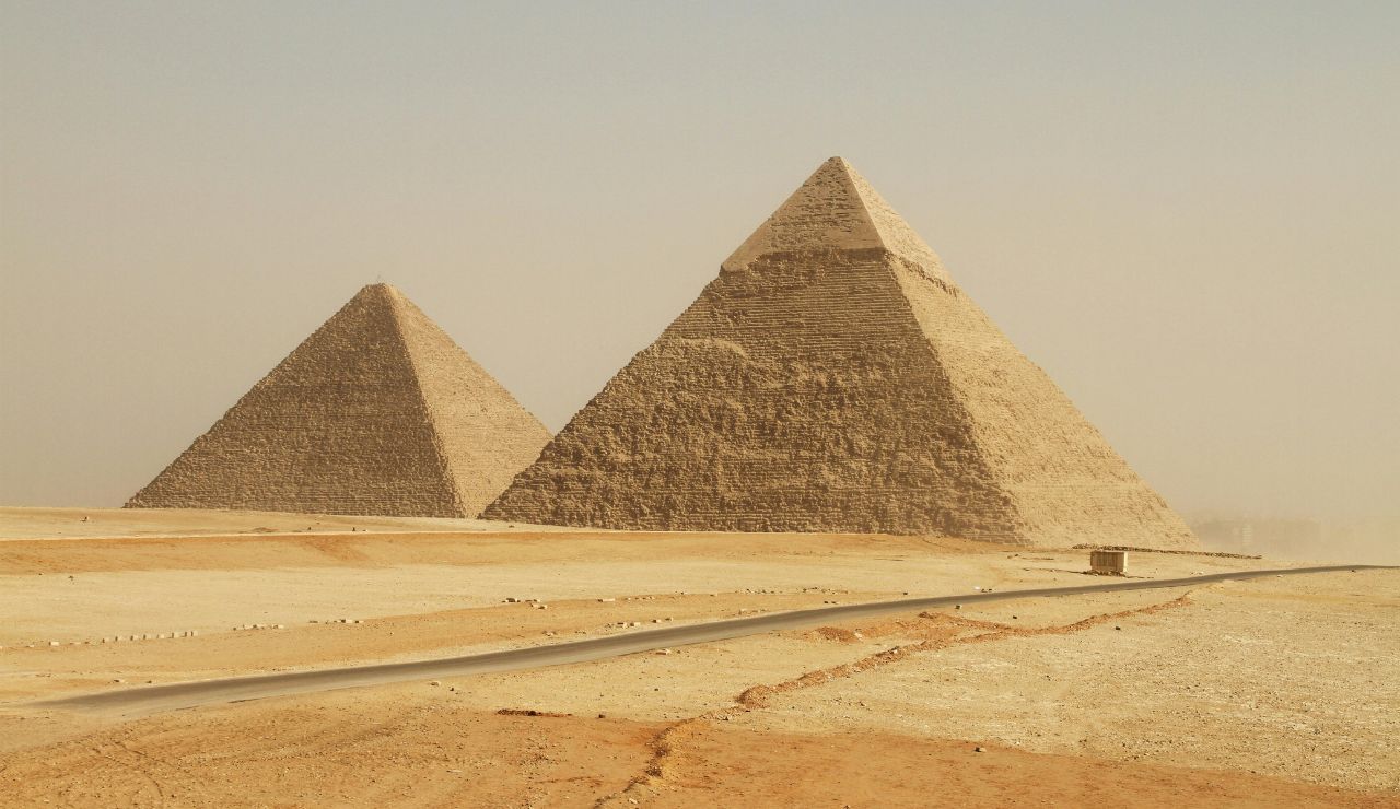 Pyramids of Giza and the Sphinx at sunset in Egypt.