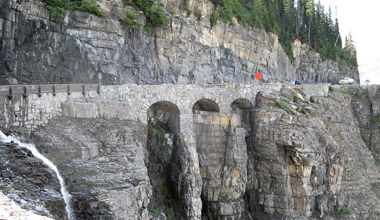 Stone bridge on a cliffside along Going-to-the-Sun Road in Glacier National Park.