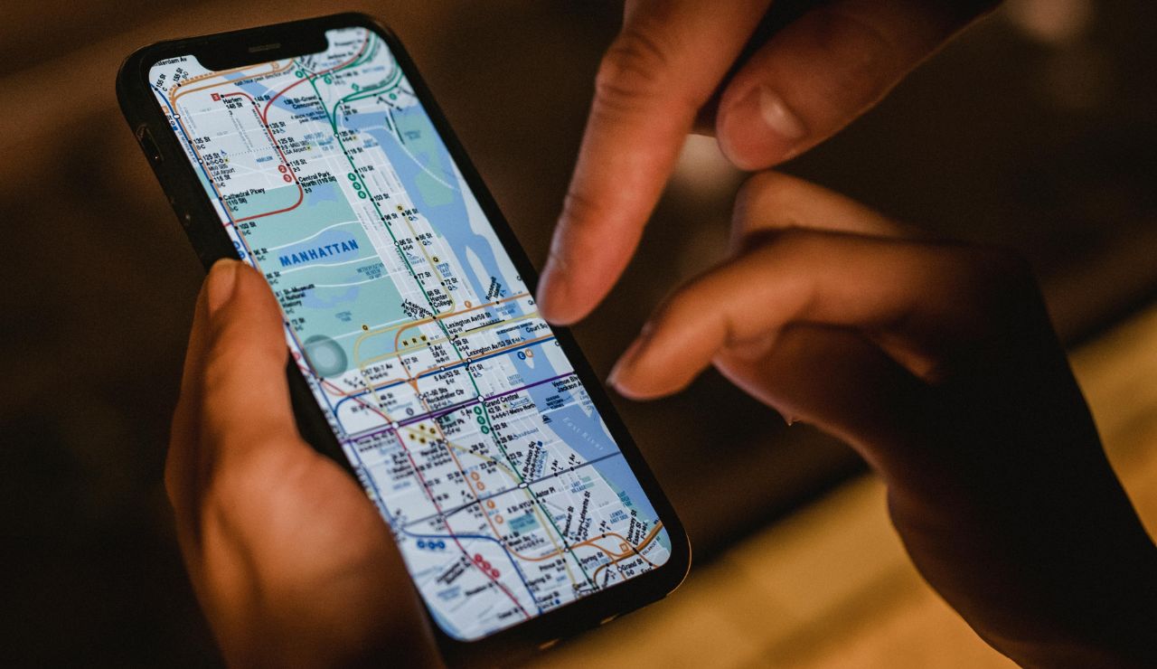 A phone screen showing an offline map being used while walking through a city.