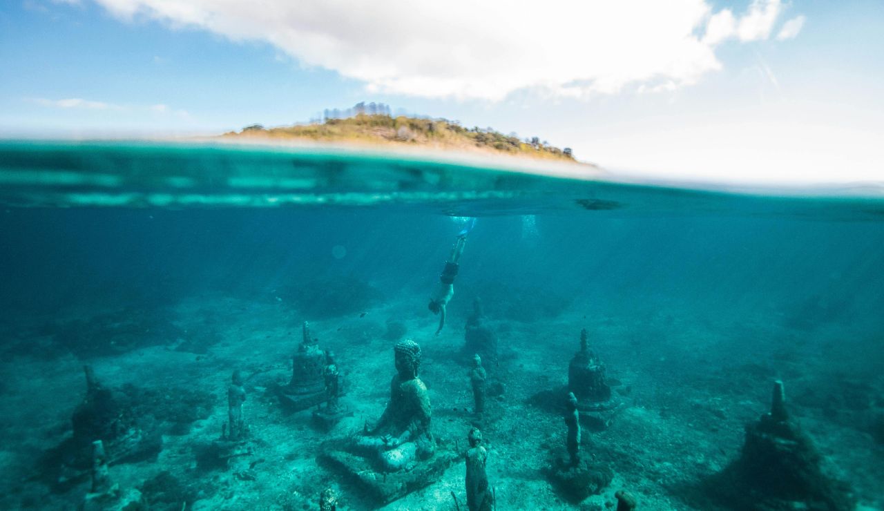 Diver near an underwater sculpture