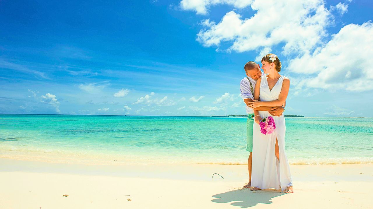 Beautiful Couple on a beach at sunset