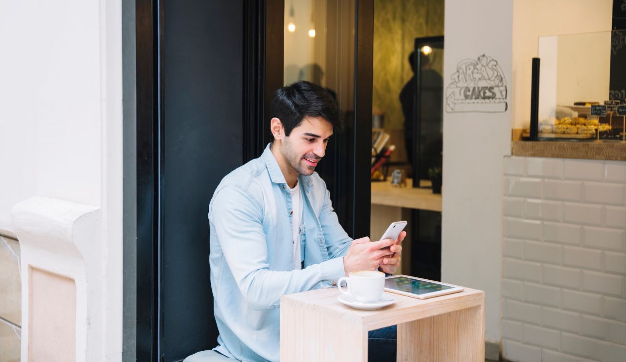 A person scrolling through a last-minute hotel app on their phone.
