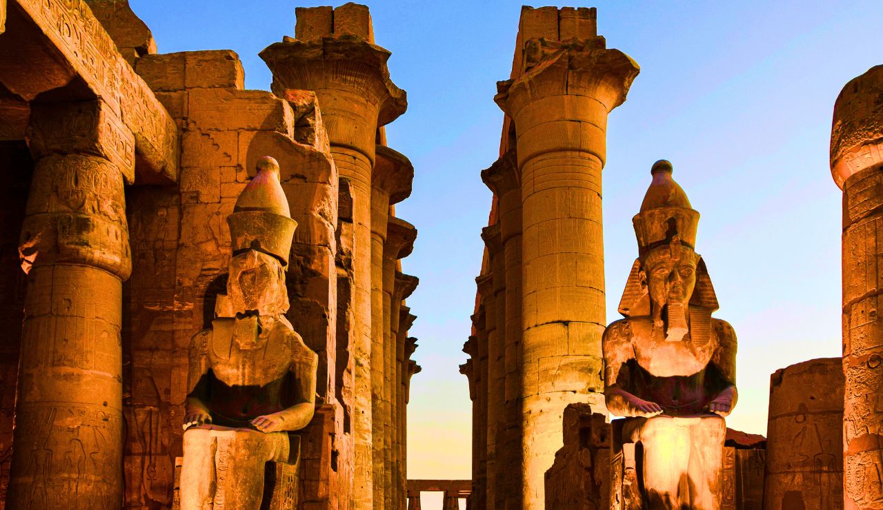 Giant sandstone columns with carved hieroglyphics at Karnak Temple