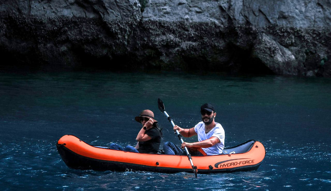 Couple kayaking through calm mangrove waters in Key Largo