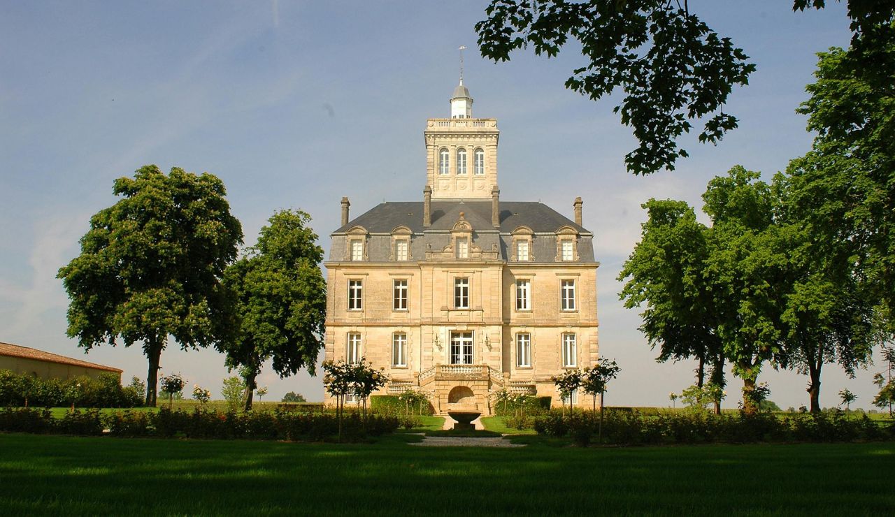 Grand facade of Schlosshotel Kronberg surrounded by greenery
