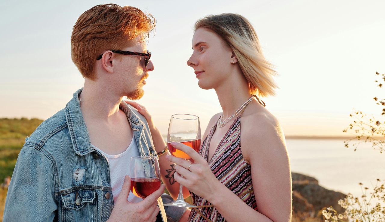 “Couple wine tasting overlooking Lake Chelan.”