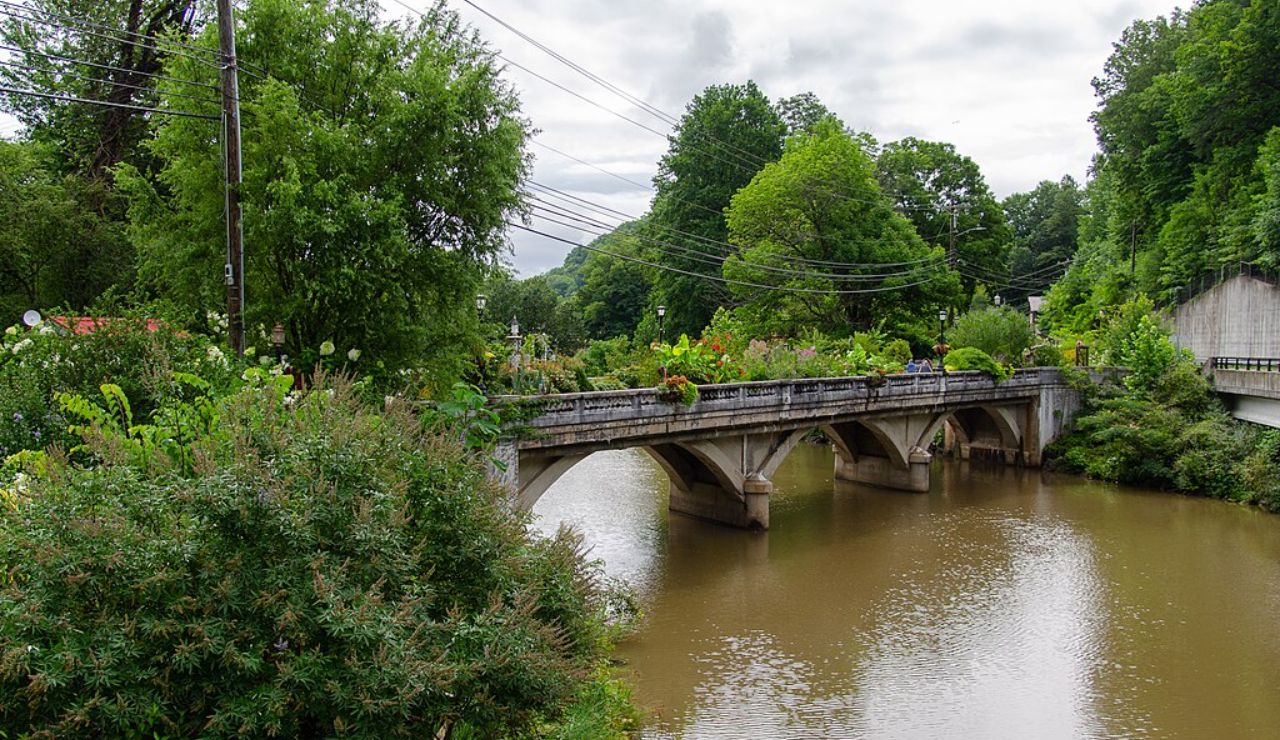Flower-lined bridge over the river at Lake Lure, North Carolina.