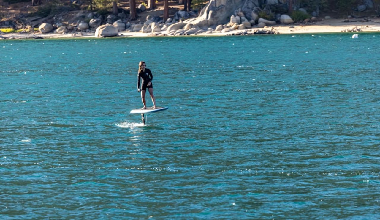 Lake Tahoe’s clear waters are perfect for eFoiling with mountain views.