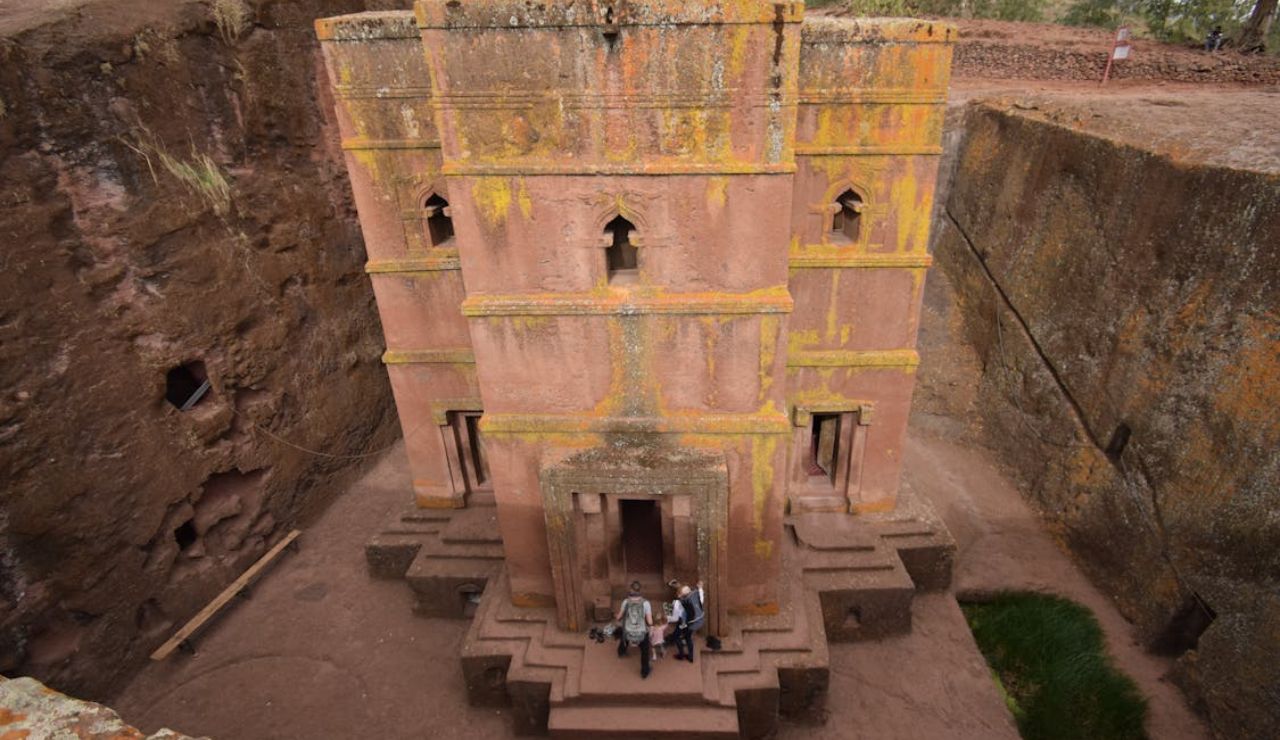 Lalibela’s rock-hewn Church of Saint George stuns with its cross shape and ancient craftsmanship.
