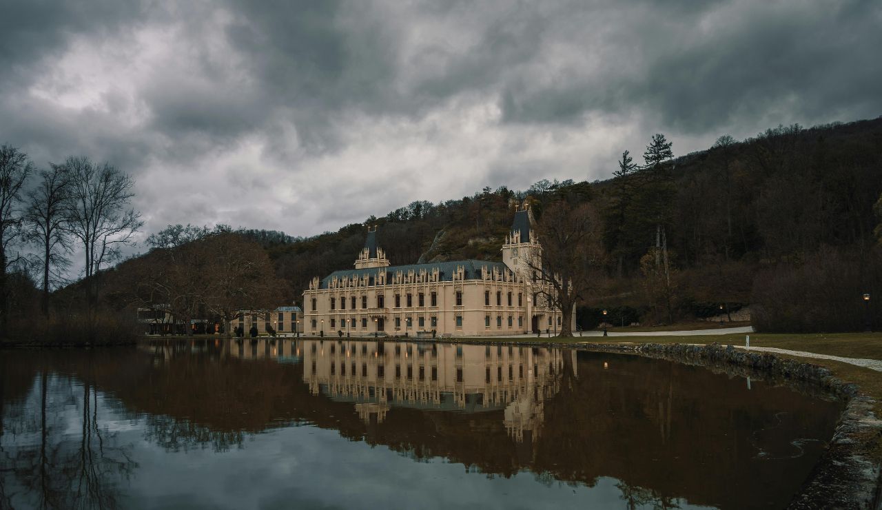 Château de Bagnols with golden stone walls and vineyard surroundings in France