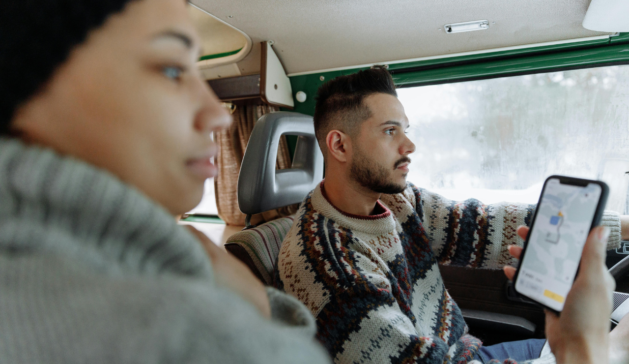 travelers navigating route with map or phone