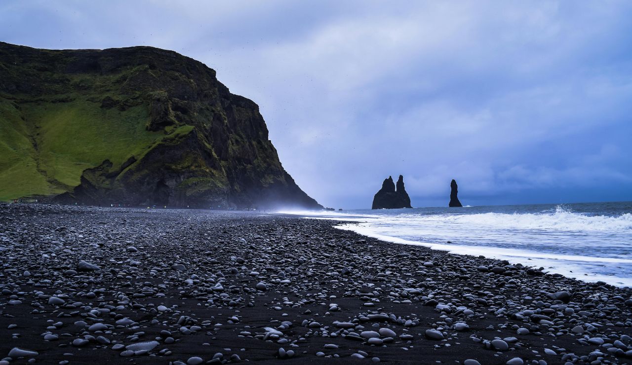 Volcanic black-sand beach beneath Mount Pelée in Martinique