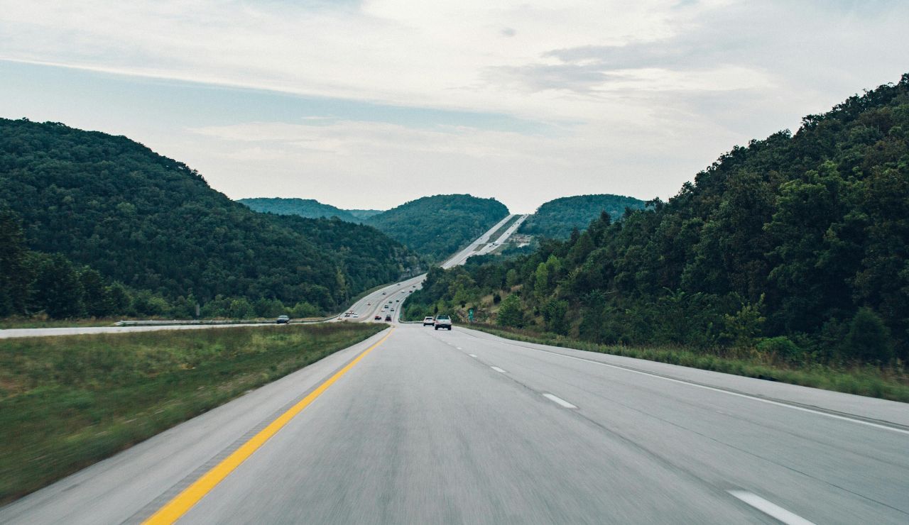open road stretching into scenic landscape
