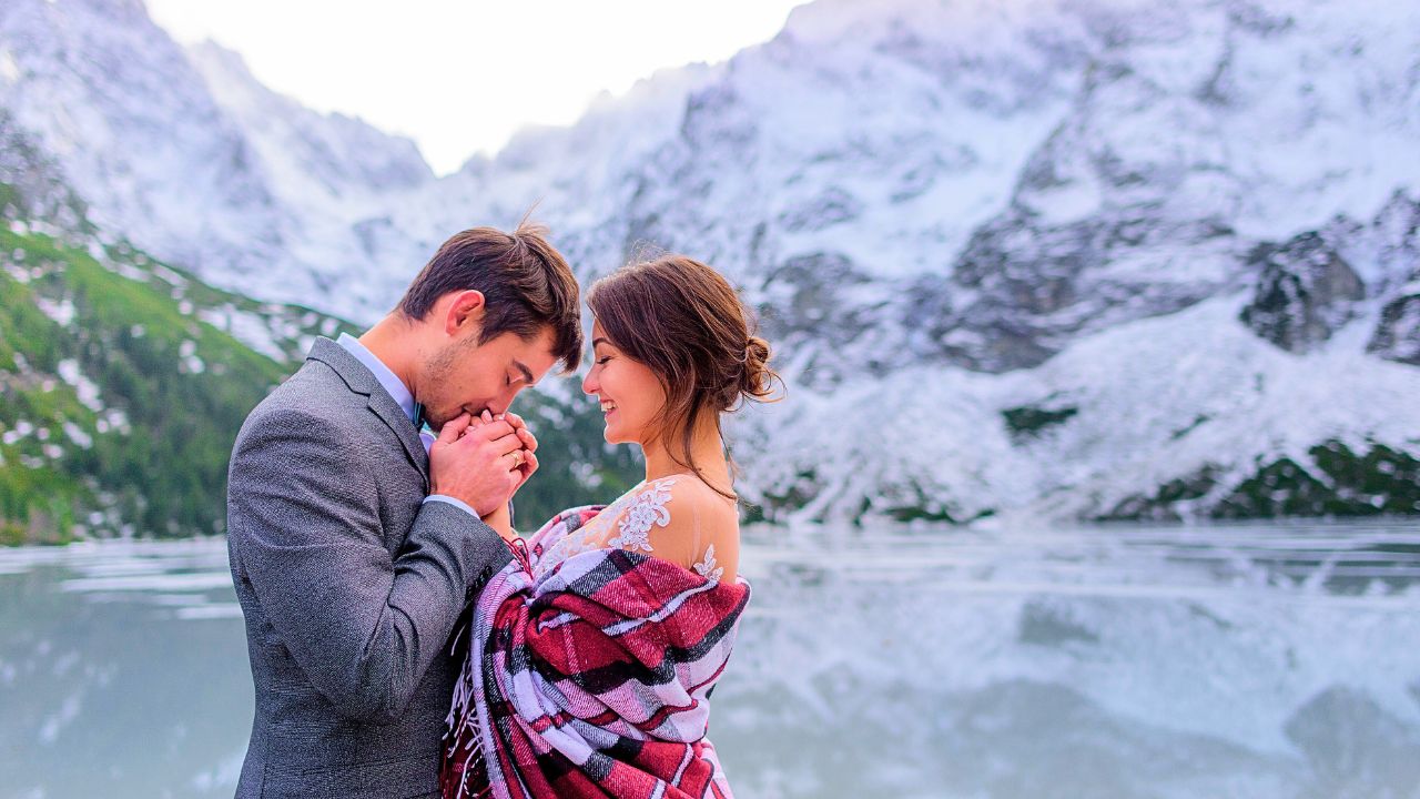 Couple standing in front of mountains in northern Pakistan