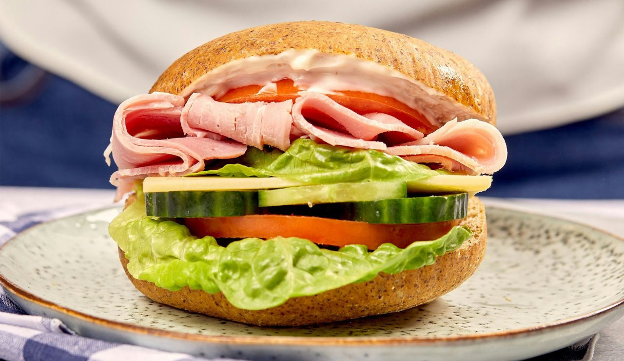 Hoagie sandwich with meats, lettuce, and tomato