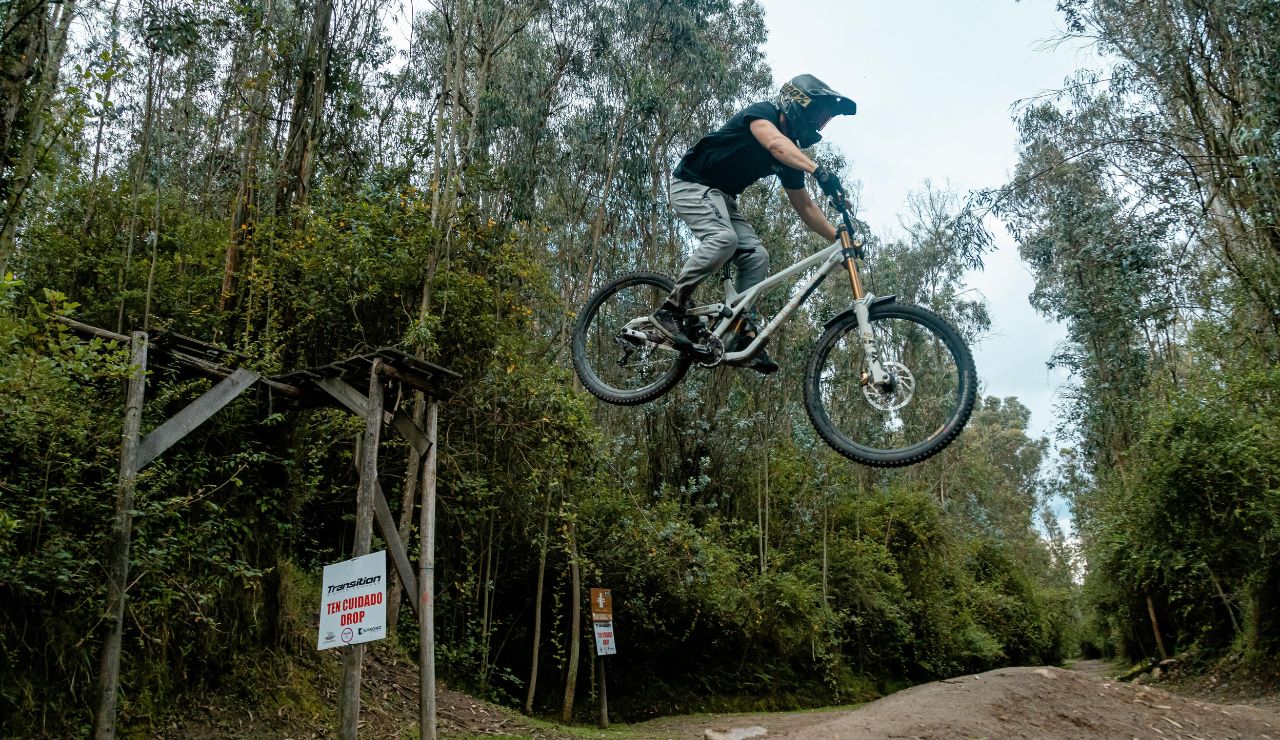 Rider on a fat-tire e-bike along a wooded mountain trail