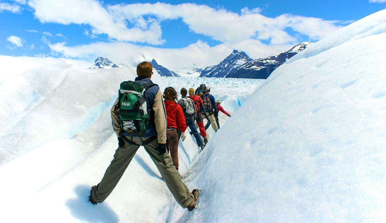 Visitor standing at a distance, admiring Mendenhall Glacier