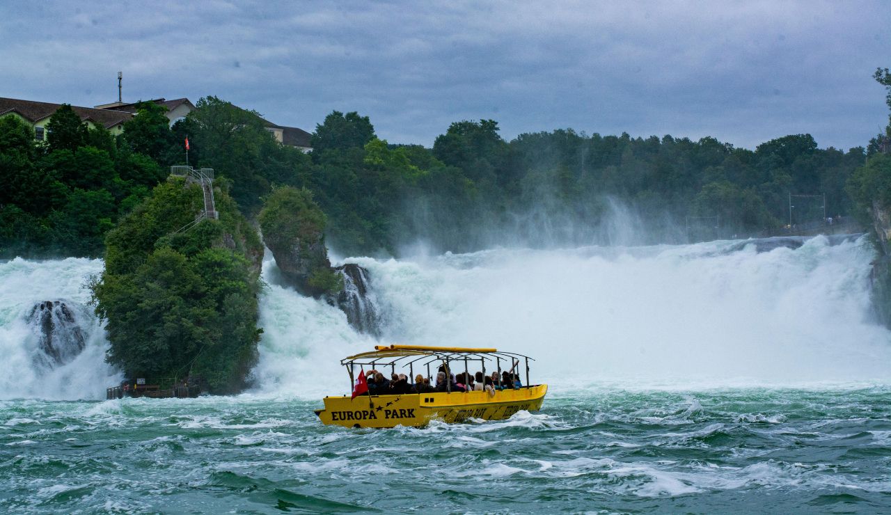 Tourists watching Rhine Falls from scenic platform