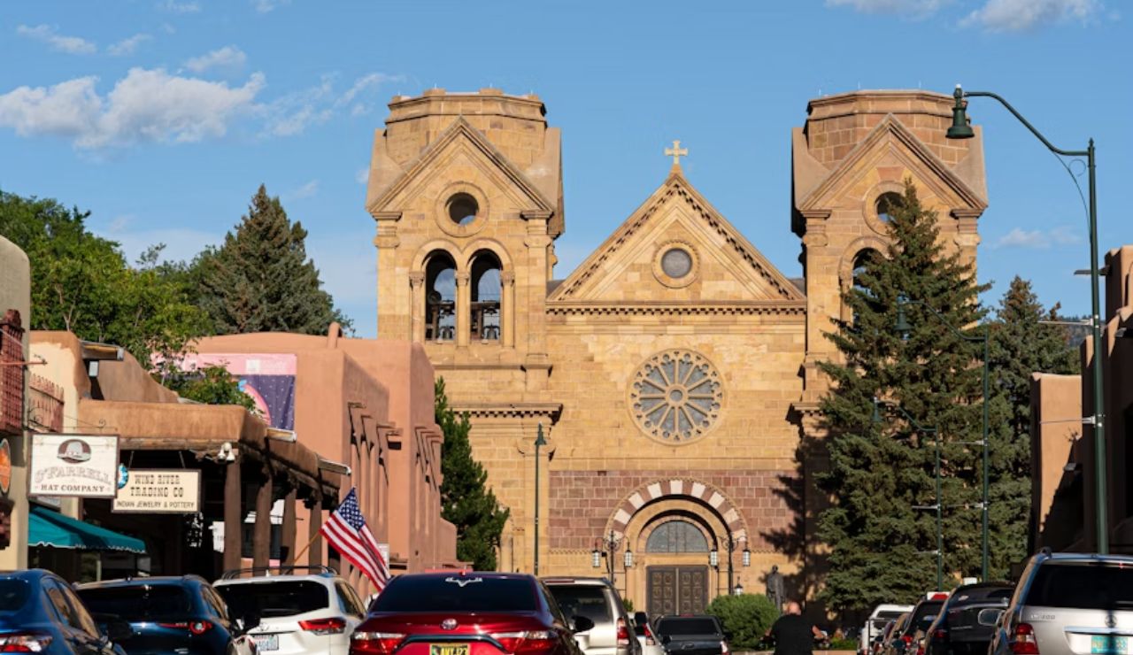 Cars lining the street in front of the Cathedral Basilica of St. Francis in Santa Fe, New Mexico.