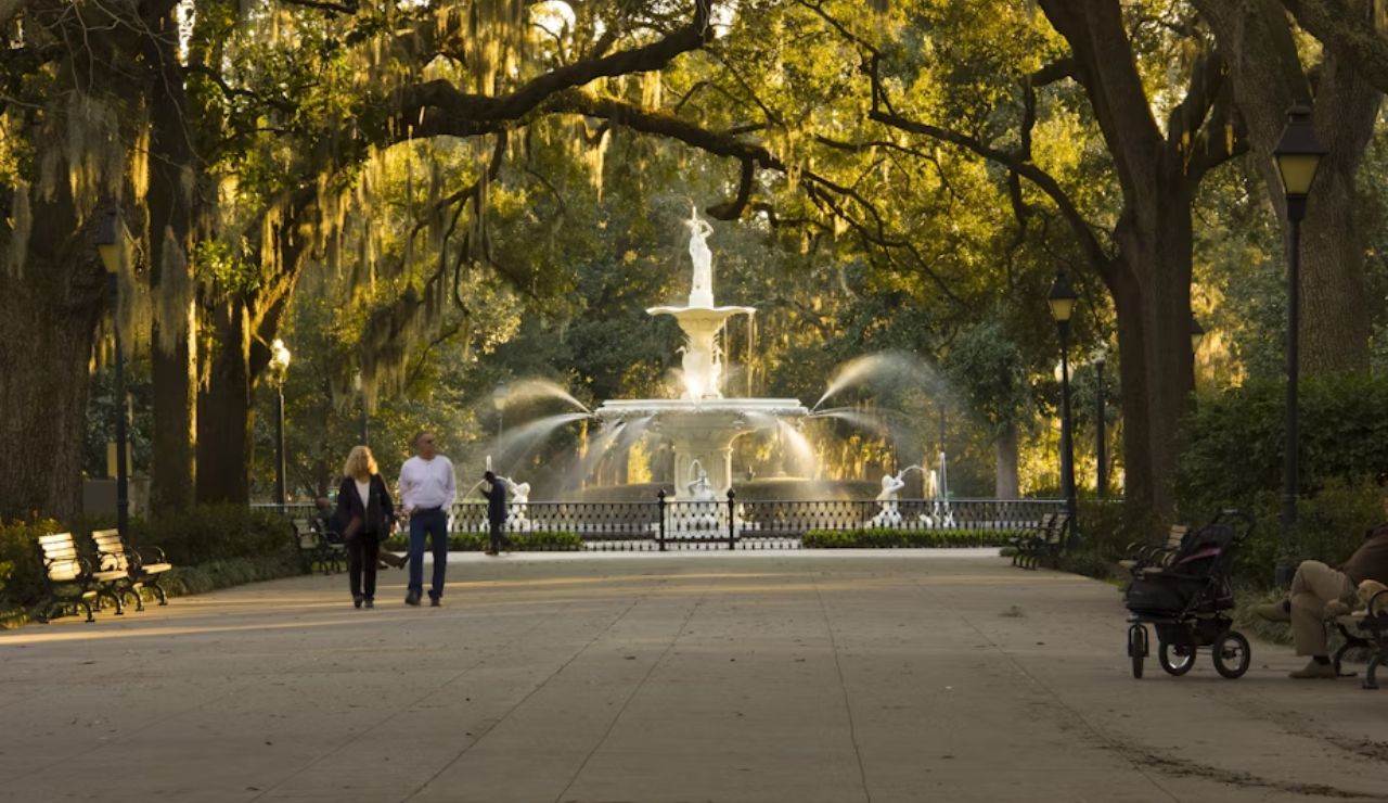 People walking near the iconic Forsyth Fountain in Forsyth Park, Savannah, Georgia.